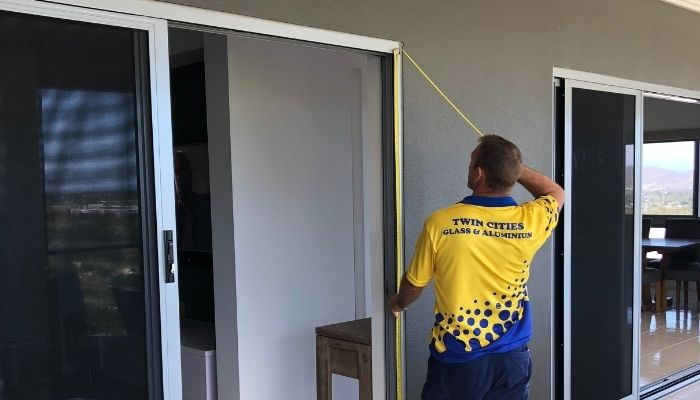 Glazier working at Twin Cities Glass and Aluminium Townsville